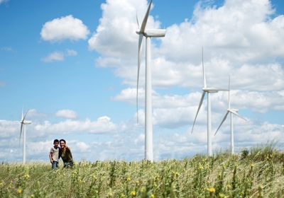 Climate Report Front Cover Family In Front Of Windfarm