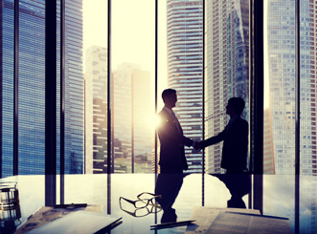 Office Skyline With Two People Shaking Hands