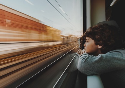 Child Looking Out Of Train Window