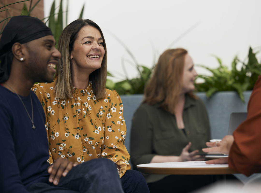 People Sitting In The Canteen Having A Meeting