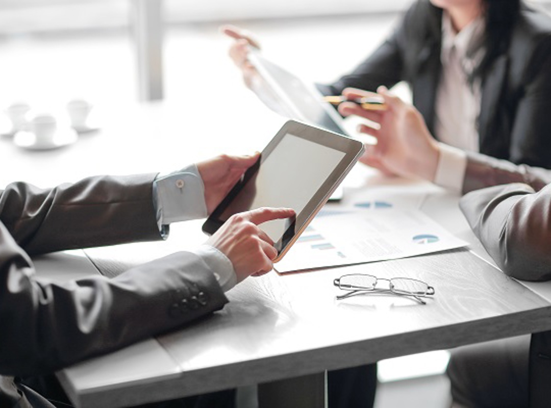 Person Working On Tablet Device